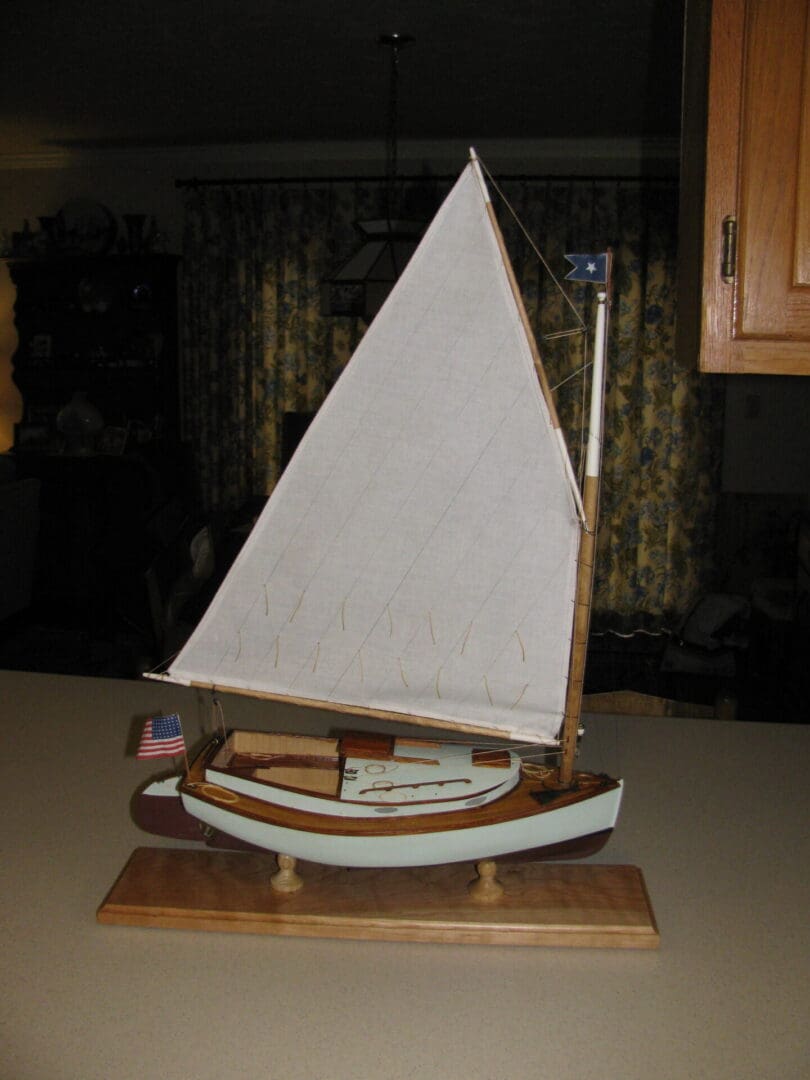 A small boat on display in the kitchen.